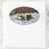 Sticker Ovale Couchage de chat sur un lit (Sac)