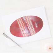 Sticker Ovale Spin Master's Sphere : Une balle de cricket à gauc (Enveloppe)
