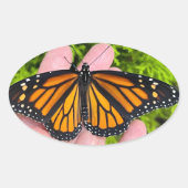 Sticker Ovale Tenir un papillon monarque (Devant)