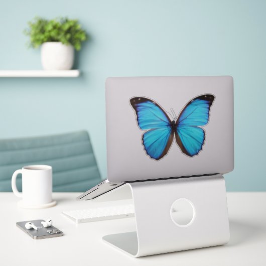 Sticker Papillon bleu 1 (Ordinateur portable sur le bureau)