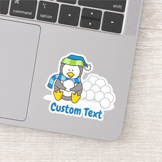 Sticker Petit pingouin assis avec des boules de neige (Détail)