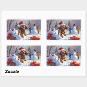 Sticker Rectangulaire Cocker Spaniel courant dans la neige avec un chape (Feuille)