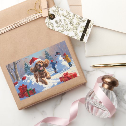 Sticker Rectangulaire Cocker Spaniel courant dans la neige avec un chape (Cadeaux)