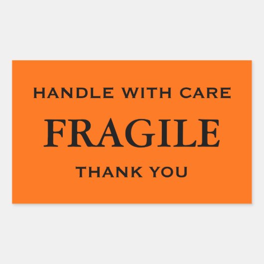 Sticker Rectangulaire Fragile orange/noir. Manipuler avec soin. Merci. (Devant)