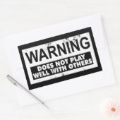 STICKER RECTANGULAIRE L'AVERTISSEMENT NE JOUE PAS BIEN AVEC LES AUTRES (Enveloppe)