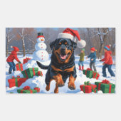 Sticker Rectangulaire Rottweiler coule en neige avec Casquette de Noël (Devant)