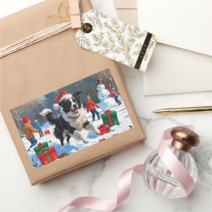 Sticker Rectangulaire Scène de Noël festive Border Collie dans la neige