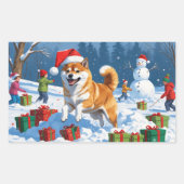 Sticker Rectangulaire Shiba Inu coule en neige avec le Casquette de Noël (Devant)