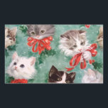 Sticker Rectangulaire Vintage Christmas Cats<br><div class="desc">Jolie image vintage de visages de chat noir,  gris et blanc jouant ou portant un arc ruban rouge. Mélangé sur un arrière - plan vert,  avec quelques feuilles de faux-pied,  ce design est parfait pour les amoureux de les chats.</div>