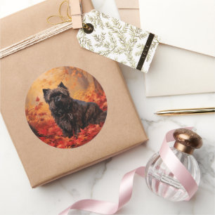 Sticker Rond Affenpinscher dans les feuilles d'automne qui tomb