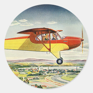 Sticker Rond Avion de transport vintage au-dessus des champs de