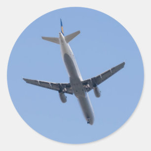 Sticker Rond Avion simple sur l'arrière - plan bleu ciel