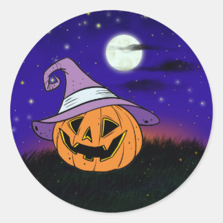 Sticker Rond Beau citrouille dans la nuit étoilée d'Halloween