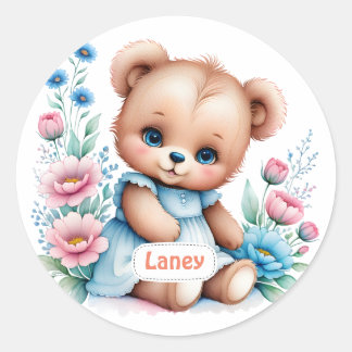 Sticker Rond Bébé Ours en peluche avec des fleurs d'aquarelle
