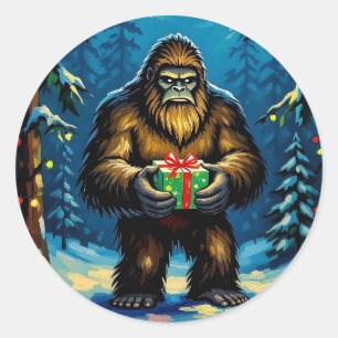 Sticker Rond Bigfoot drôle tenant un cadeau de Noël