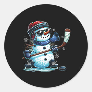 Sticker Rond Bonhomme de neige drôle jouant aux amateurs de hoc