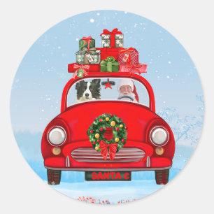 Sticker Rond Border Collie dans une voiture avec le Père Noël 