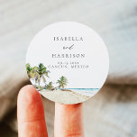 Sticker Rond CANCUN Aquarelle Plage Palmier Destination<br><div class="desc">La collection Cancun présente une aquarelle représentant des plages de sable fin et des palmiers tropicaux. Modifiez les noms de votre mariage pour ajouter une touche spéciale.</div>