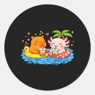 Sticker Rond Capybara Axolotl sur radeaux de piscine buvant du