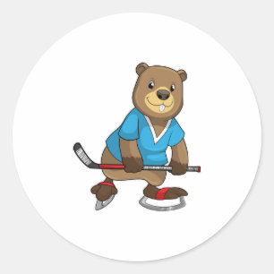 Sticker Rond Castor au hockey sur glace avec bâton de hockey su