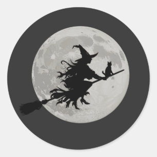 Sticker Rond Chat aux sorcières d'Halloween volant à travers un