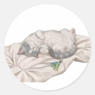 Sticker Rond Chat endormi adorable BB reposant sur un coussin d