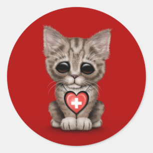 Sticker Rond Chat mignon de chaton avec le coeur suisse de