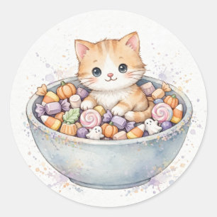 Sticker Rond Chaton dans un bol de bonbons d'Halloween