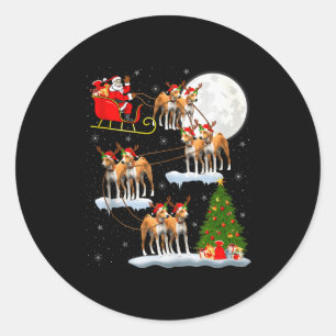 Sticker Rond Chien Basenji Santa Traîneau Volant Drôle Magique