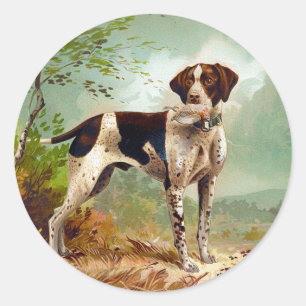 Sticker Rond Chien de chasse avec oiseau dans la bouche