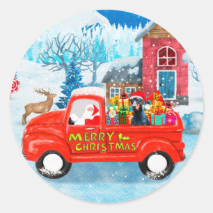 Sticker Rond Chien Doberman dans un camion de livraison de Noël