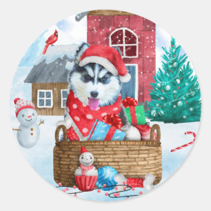 Sticker Rond Chien Husky Sibérien dans la maison de Noël enneig