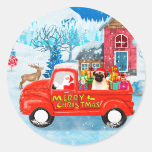 Sticker Rond Chien Pug camion de livraison de Noël enneigé