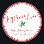 Sticker Rond Christmas Holly Joy Peace Love Script Custom<br><div class="desc">Célébrez la saison avec cette belle étiquette d'adresse de retour de vacances qui contient les mots JOY PEACE LOVE dans une élégante police de caractères rouge et une épée de saint aquarellé festif ci-dessous. Personnalisez en ajoutant votre propre salutation et votre nom. Beau et classique mais simple et tendance, un...</div>