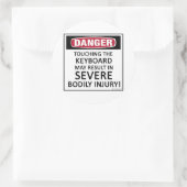 Sticker Rond Clavier de danger (Sac)