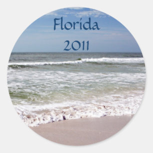Sticker Rond Crash des vagues sur la plage de sable