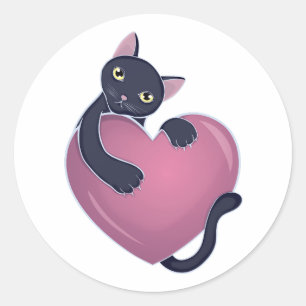 Sticker Rond Cute chat noir se tenant sur le grand coeur