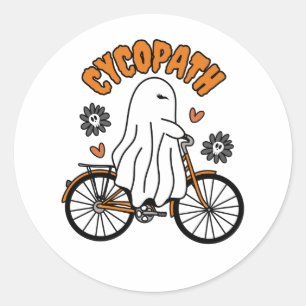Sticker Rond Cycopath Halloween fantôme sur un vélo orange