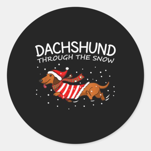 Sticker Rond Dachshund à travers la neige drôle chien Noël (Devant)