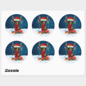 Sticker Rond Dachshund Chien en neige avec cadeaux de Noël (Feuille)
