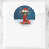 Sticker Rond Dachshund Chien en neige avec cadeaux de Noël (Sac)
