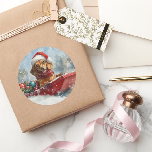 Sticker Rond Dachshund Dog in Sledge Let it neige Noël (Cadeaux)
