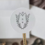 Sticker Rond DAPHNE Simple Noir Blanc Vintage Mariage Monogramm<br><div class="desc">Ces simples autocollants de monogramme de mariage noir et blanc vintage de la Collection Daphné sont parfaits pour un mariage traditionnel. Le design simple mais classique présente un monogramme de crête élégant et intemporel avec des fleurs et de la verdure entourant les initiales du couple.</div>