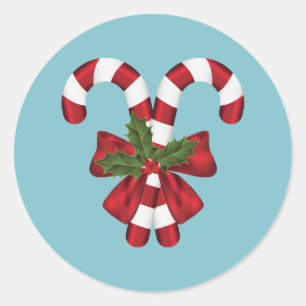 Sticker Rond Deux cannes de bonbon rouges et blanches sur fond