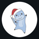 Sticker Rond Dino Christmas Dinos Animaux d'hiver<br><div class="desc">Le chien dinosaure pour Noël avec des lumières de fées. Animaux amusants avec des cadeaux et de la neige pour les vacances. Aussi drôle pour Noël en juillet. Les dinos sont des animaux mignons et parfaits pour Noël.</div>