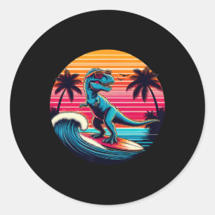 Sticker Rond Dinosaure drôle surfant sur le coucher de soleil r