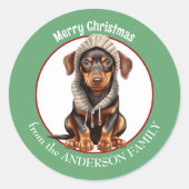 Sticker Rond Doberman Pinscher chiot en hiver Noël Casquette (Devant)