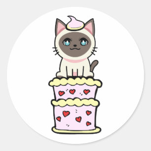 Sticker Rond Drôle chat siamois sautant d'un gâteau