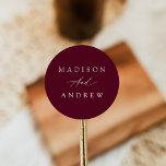 Sticker Rond Élégante calligraphie Mariage Bourgogne<br><div class="desc">Des autocollants de mariage simples et calligraphiques avec vos noms en lettres blanches avec un arrière - plan bordeaux. Les autocollants de mariage bordeaux sont parfaits pour les enveloppes, les faveurs de mariage, et plus ! Les élégants autocollants de mariage ont été conçus pour coordonner avec notre collection Elegant Calligraphy...</div>