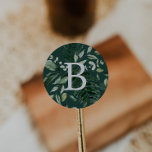 Sticker Rond Émeraude | Phoques d'enveloppe Monogramme vert<br><div class="desc">Ces enveloppes de monogramme vert émeraude sont parfaites pour un mariage boho. Le design élégant et rustique présente des feuilles d'aquarelle vert foncé moody et des eucalyptus aux tons bohèmes modernes. Personnalisez le étiquette avec la dernière initiale de la mariée et du marié.</div>